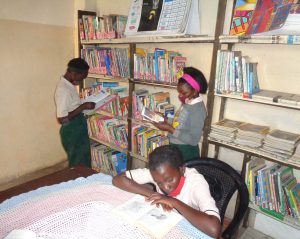 TOSF reading in the library. TOSF learners reading in the library.